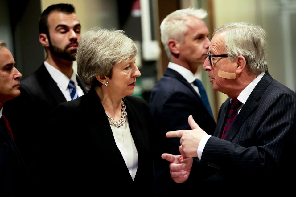 European Commission President Jean-Claude Juncker, right, speaks with British Prime Minister Theresa May prior to a meeting at EU headquarters in Brussels, Wednesday, Feb. 20, 2019. European Commission President Jean-Claude Juncker and British Prime Minister Theresa May meet Wednesday for their latest negotiating session to seek an elusive breakthrough in Brexit negotiations. (AP Photo/Olivier Matthys)