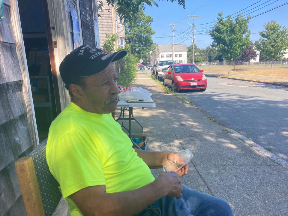 Buddy Andrade, director of Old Bedford Village Development Corporation in New Bedford, sits in the shade outside his office. Andrade's neighborhood is what the Environmental Protection Agency calls a 'heat Island."