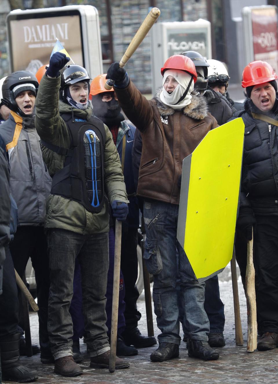 Protesters attend a march in central Kiev, Ukraine, Monday, Jan. 27, 2014. Ukraine's justice minister is threatening to call for a state of emergency unless protesters leave her ministry building, which they occupied during the night. The seizure of the building early Monday underlined how anti-government demonstrators are increasingly willing to take dramatic action as they push for the president's resignation and other concessions. (AP Photo/Sergei Grits)