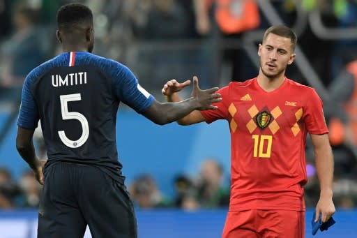 Belgium captain Eden Hazard congratulates France's matchwinner Samuel Umtiti