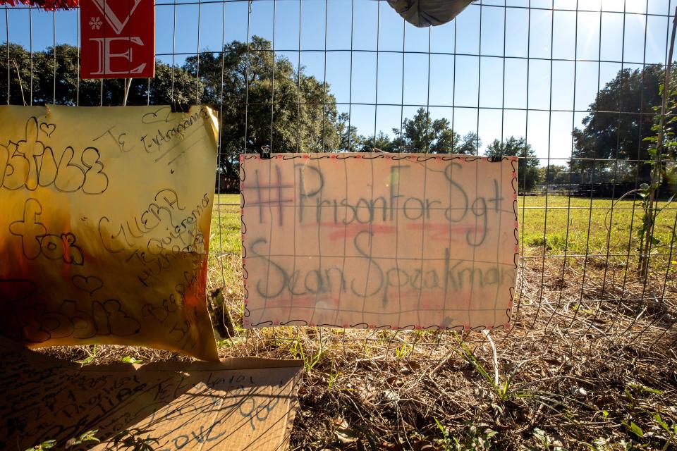 A makeshift memorial with flowers , balloons and messages are set against a fence on a dirt road off Rifle Range Road near Noles Avenue where Jessiram Hweih Rivera was shot by Polk County Sheriff Deputy Sean Speakman as she was coming toward him wielding a shovel in Wahneta Fl. Tuesday November 23 2021.  ERNST PETERS/ THE LEDGER