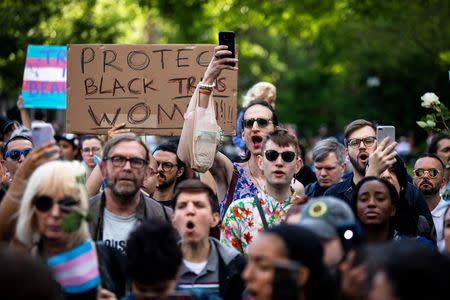 Transgender rights activists protest the recent killings of three transgender women, Muhlaysia Booker, Claire Legato, and Michelle Washington during a rally at Washington Square Park in New York, U.S., May 24, 2019. REUTERS/Demetrius Freeman