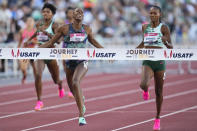 Shamier Little wins the women's 400 meter hurdles final ahead of Dalilah Muhammad, who finished second, during the U.S. track and field championships in Eugene, Ore., Sunday, July 9, 2023. (AP Photo/Ashley Landis)