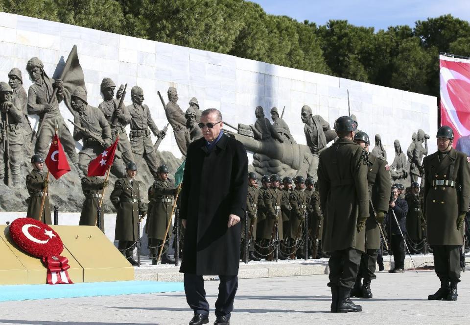 Turkey's President Recep Tayyip Erdogan walks during a ceremony marking the 102nd anniversary of Gallipoli campaign, in Gallipoli peninsula where troops under British command landed in 1915, Saturday, March 18, 2017. Cheered by flag-waving supporters, the Turkish president turned a commemoration of a World War I campaign into a political rally on Saturday, slamming Europe and declaring that a constitutional referendum next month on whether to expand his powers will enhance Turkey's place in the world.(Kayhan Ozer/Presidential Press Service, Pool Photo via AP)