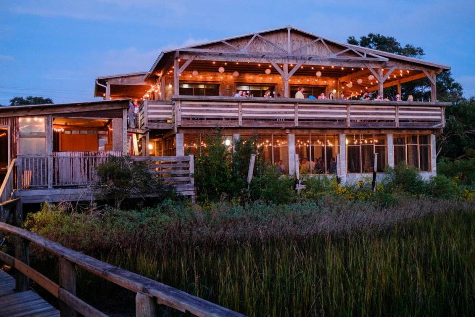 Bowen’s Island Restaurant hosts an oyster roast event for a wedding rehearsal party with some of the season’s first oysters from the Folly River near Charleston, S.C. Oct. 8, 2021.