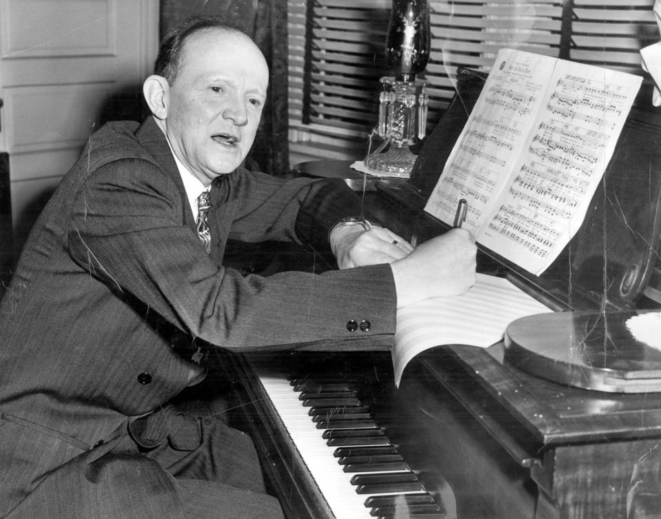 Haven Gillespie, Covington songwriter, works at his piano on one of his new lyrics in 1949.