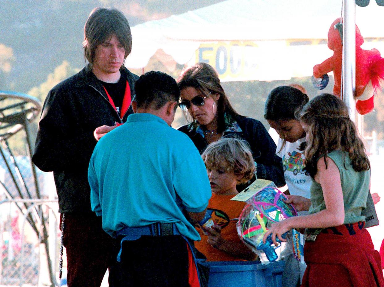 Benjamin Keough, centre, pictured as a child with his family in 2000: Getty Images