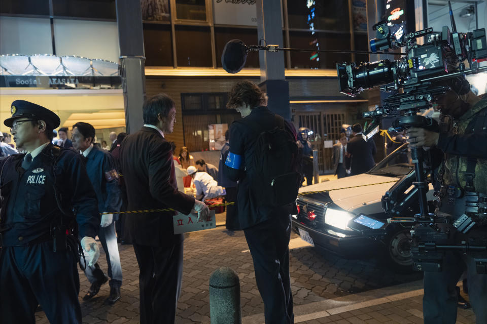 Watanabe and Elgort, preparing to shoot their characters’ encounter in Akasaka.