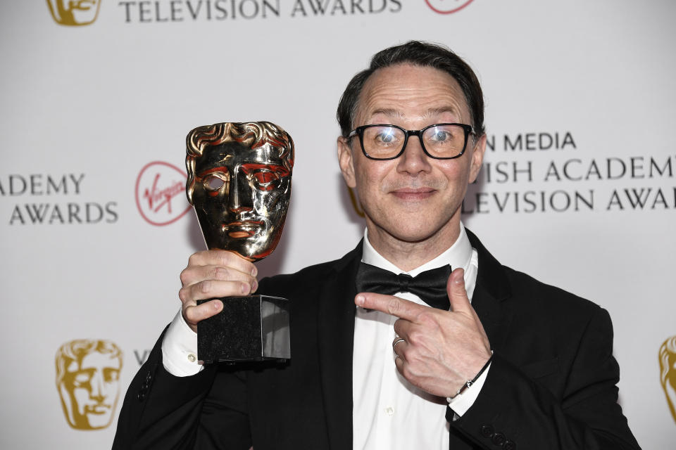 Reece Shearsmith poses for photographers with his Scripted Comedy award for 'Inside No.9' backstage at the British Academy Television Awards in London, Sunday, June 6, 2021. (AP Photo/Alberto Pezzali)