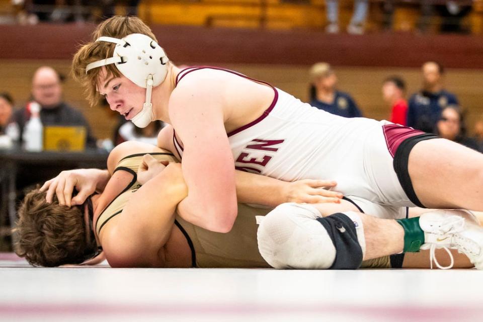 Mishawaka's Beau Brabender and Penn's Christopher Scott wrestle in the 157-pound championship match of the sectional wrestling meet Saturday, Jan. 27, 2024 at Mishawaka High School.