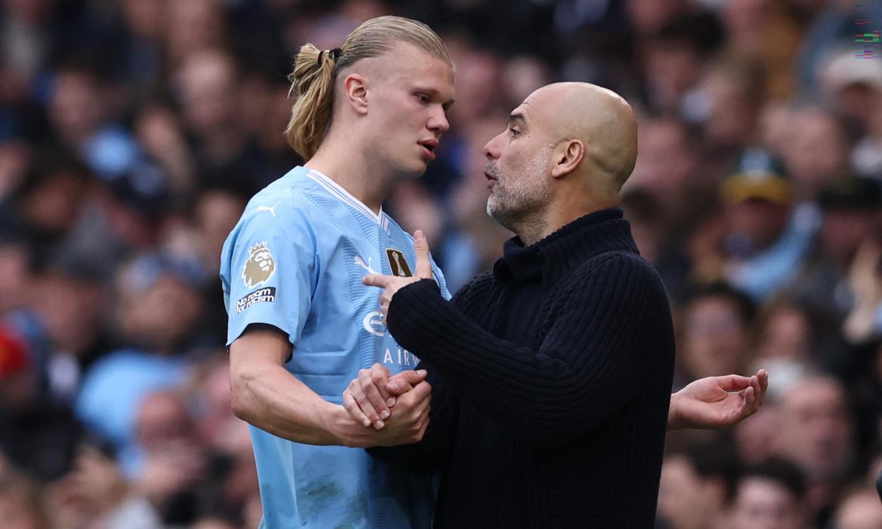 <span>Pep Guardiola speaks with Erling Haaland as he leaves the pitch after being substituted against Wolves last week. </span><span>Photograph: Darren Staples/AFP/Getty Images</span>