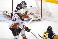 Pittsburgh Penguins' Brock McGinn (23) gets a shot past Anaheim Ducks goaltender John Gibson (36) for a goal with Kevin Shattenkirk (22) defending during the first period of an NHL hockey game in Pittsburgh, Saturday, Dec. 11, 2021.(AP Photo/Gene J. Puskar)