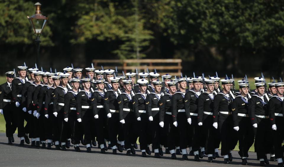 Navy band march prior to the arrival of Pope Francis at the Presidential residence in Dublin, Ireland, Saturday, Aug. 25, 2018. Pope Francis is on a two-day visit to Ireland. (AP Photo/Peter Morrison)