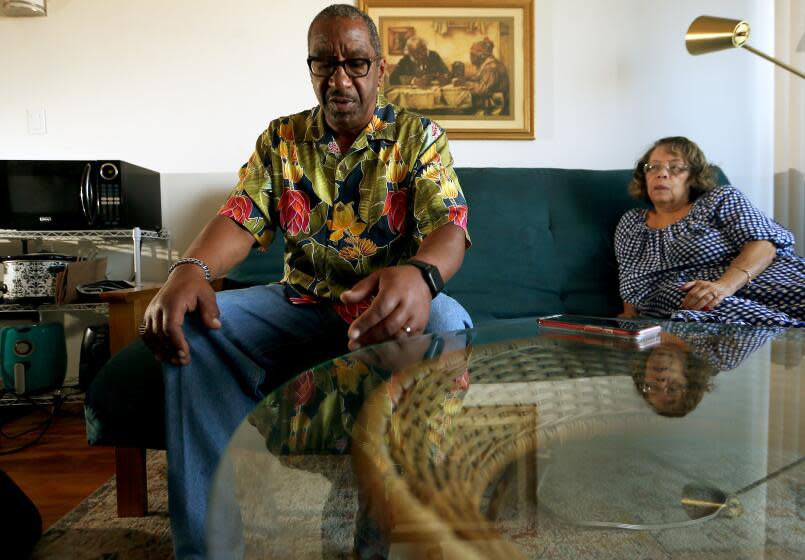 Long Beach, CA - David Moreland, 67, recounts his bout with Covid in Soledad Prison as his wide Sherry listens on Tuesday, Aug. 8, 2023. Moreland suffers from long Covid symptoms. He was recently released from prison under the governor's new "medical reprieve" program. He served 20 years for robbery and carjacking crimes he says he did not commit. August 08: in Long Beach on Tuesday, Aug. 8, 2023 in Long Beach, CA. (Luis Sinco / Los Angeles Times)