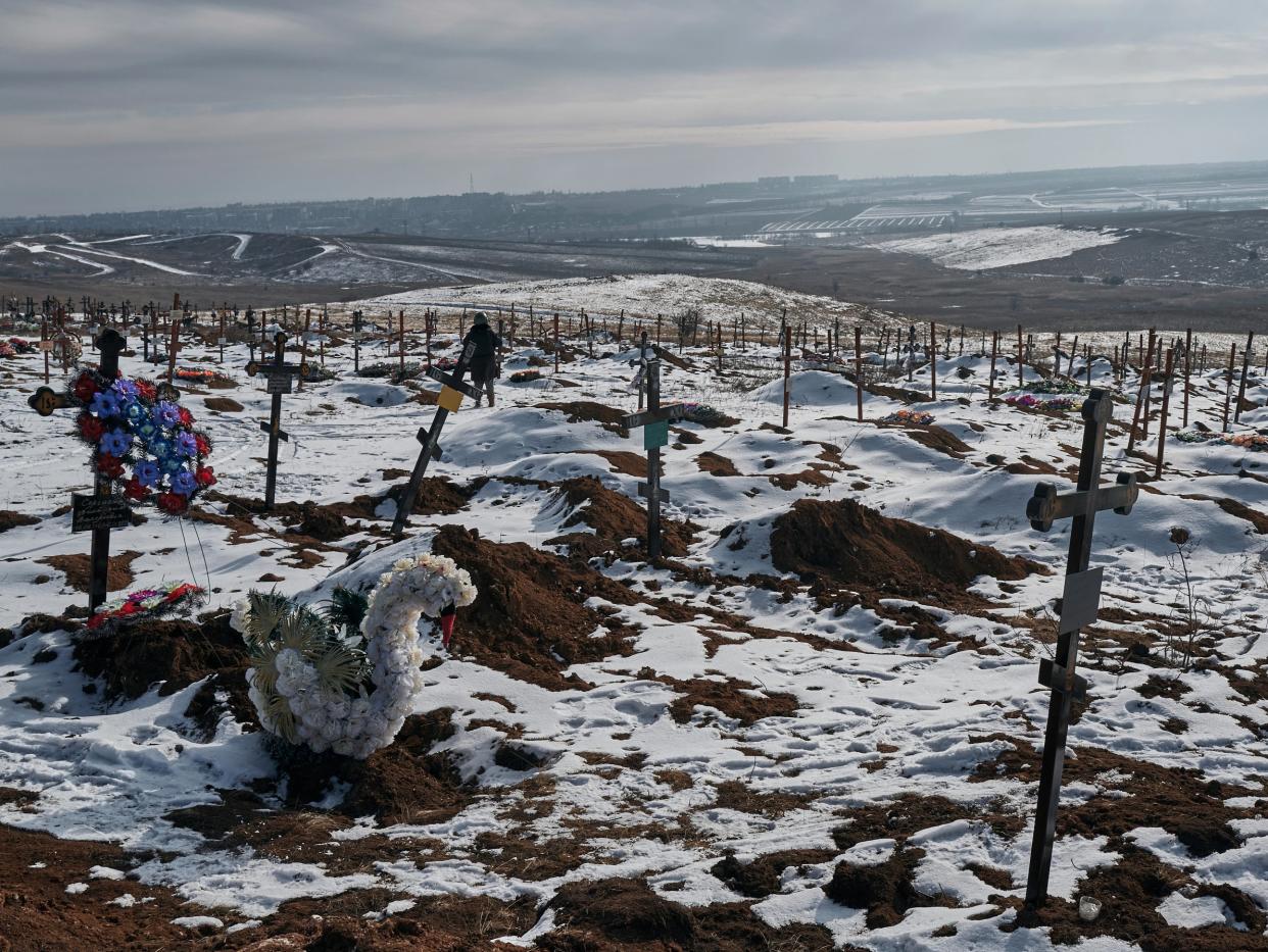 New graves and crosses in a city cemetery (AP)