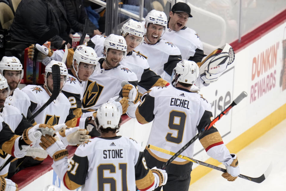 Vegas Golden Knights' Jack Eichel (9) returns to the bench after scoring during the first period of an NHL hockey game against the Pittsburgh Penguins in Pittsburgh, Thursday, Dec. 1, 2022. (AP Photo/Gene J. Puskar)