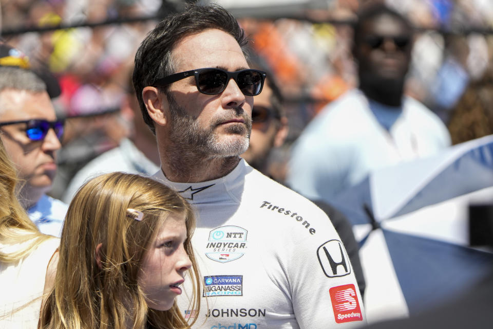 Driver Jimmie Johnson watches a videoboard before the Indianapolis 500 auto race at Indianapolis Motor Speedway in Indianapolis, Sunday, May 29, 2022. (AP Photo/AJ Mast)