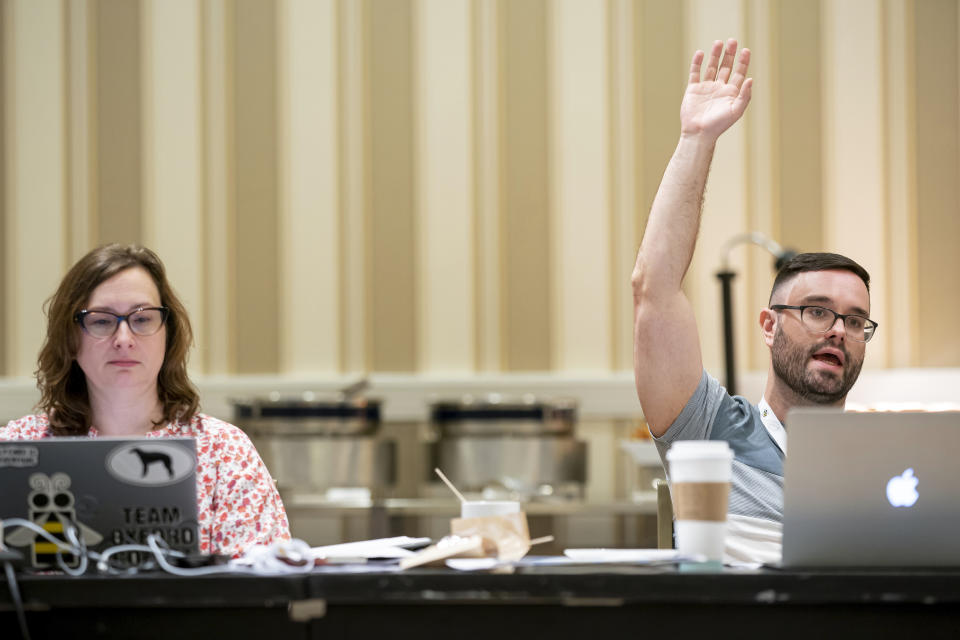 Maggie Lorenz, left, and Kevin Moch participate in a meeting of the word panel to finalize the 2023 Scripps National Spelling Bee words on Sunday, May 28, 2023, at National Harbor in Oxon Hill, Md. (AP Photo/Nathan Howard)