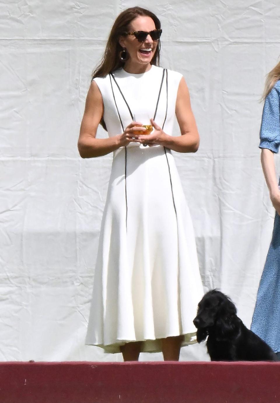 Catherine Duchess of Cambridge and dog Prince William at Out-Sourcing Inc. Royal Charity Polo Cup at Guards Polo Club