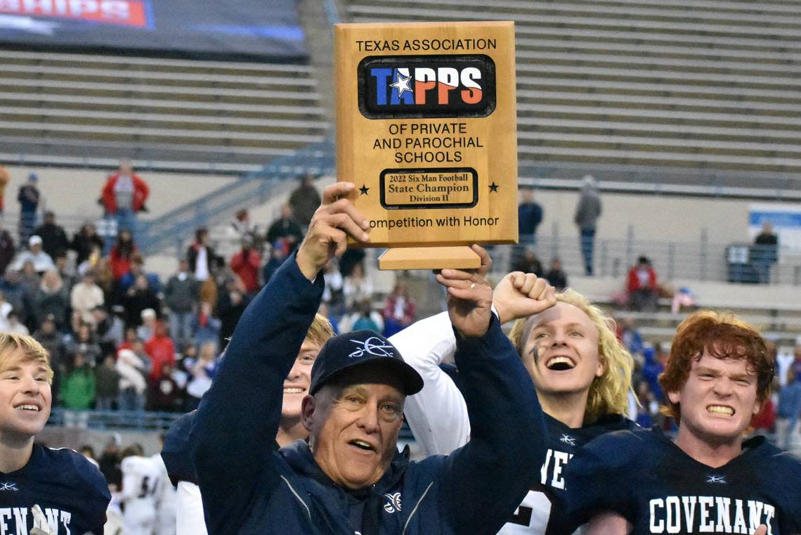 Fort Worth Covenant Classical coach Ron Abrams hold up the TAPPS Division II 6 Man championship trophy after his Cavaliers defeated Pasadena First Baptist 68-30 on Thursday, December 1, 2022 at Waco ISD Stadium. Courtesy Antony Blalock/txhsfb.net
