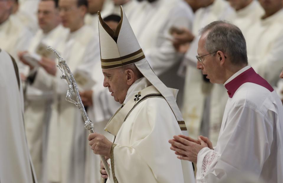 Pope Francis arrives to celebrate Chrism Mass, inside St. Peter's Basilica, at the Vatican, Thursday, April 18, 2019. During the Mass the Pontiff blesses a token amount of oil that will be used to administer the sacraments for the year. (AP Photo/Alessandra Tarantino)