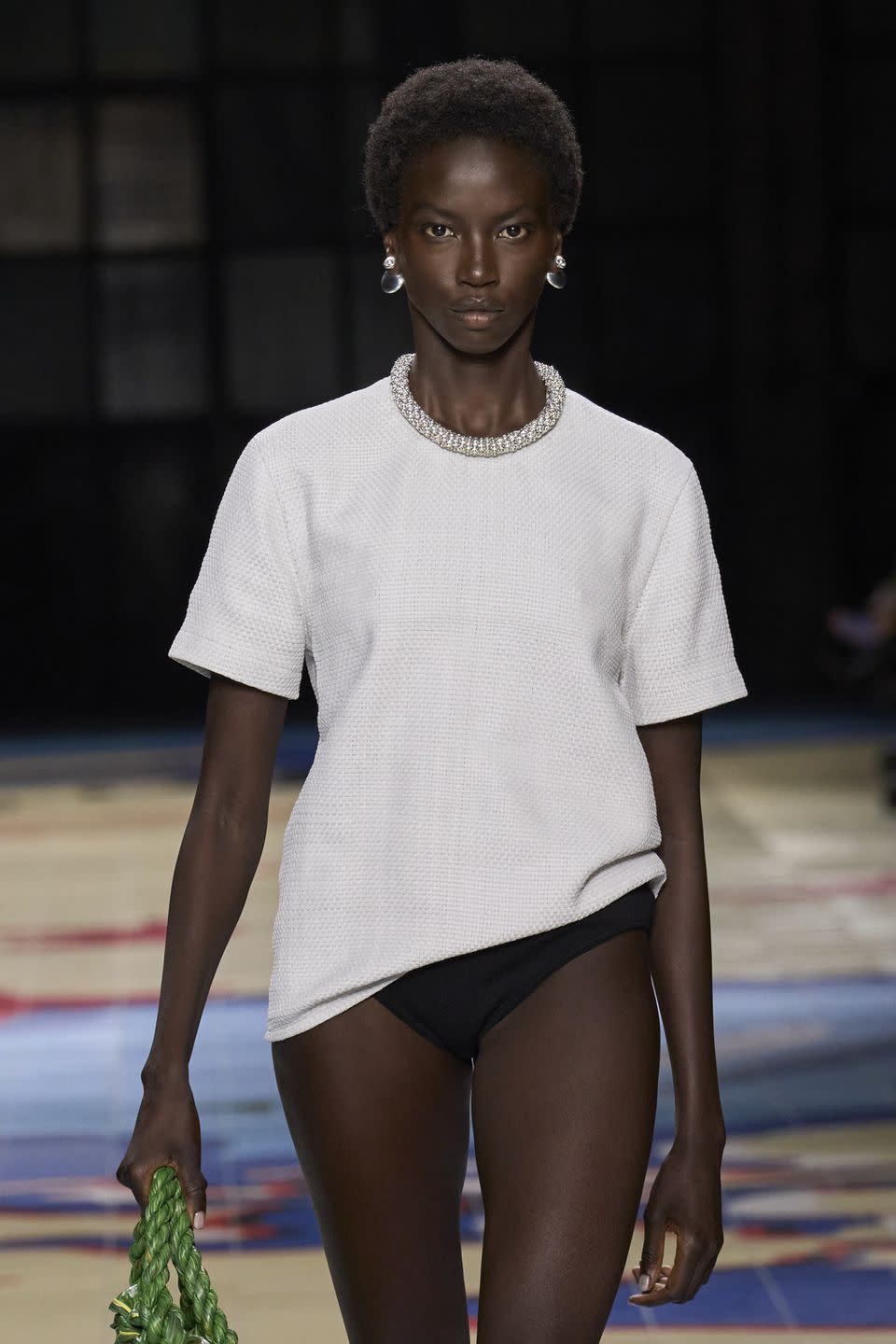 a woman walking on a runway