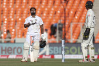 India's Rishabh Pant, left, celebrates scoring a century during the second day of fourth cricket test match between India and England at Narendra Modi Stadium in Ahmedabad, India, Friday, March 5, 2021. (AP Photo/Aijaz Rahi)