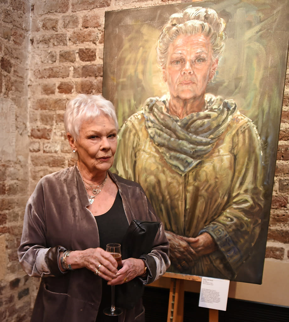 Judi Dench poses with herself