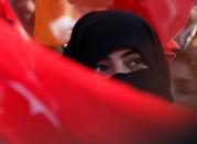 A female supporter of Turkish President Tayyip Erdogan attends a rally in Mardin, capital of Mardin province in southeastern Turkey, June 20, 2018. REUTERS/Goran Tomasevic