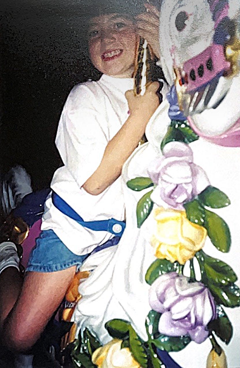 megan riding the carousel at disney world as a kid 30 years ago