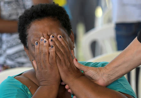 A resident reacts during an ecumenical service in memory of victims of a collapsed tailings dam owned by Brazilian mining company Vale SA, in Brumadinho, Brazil January 31, 2019. REUTERS/Washington Alves