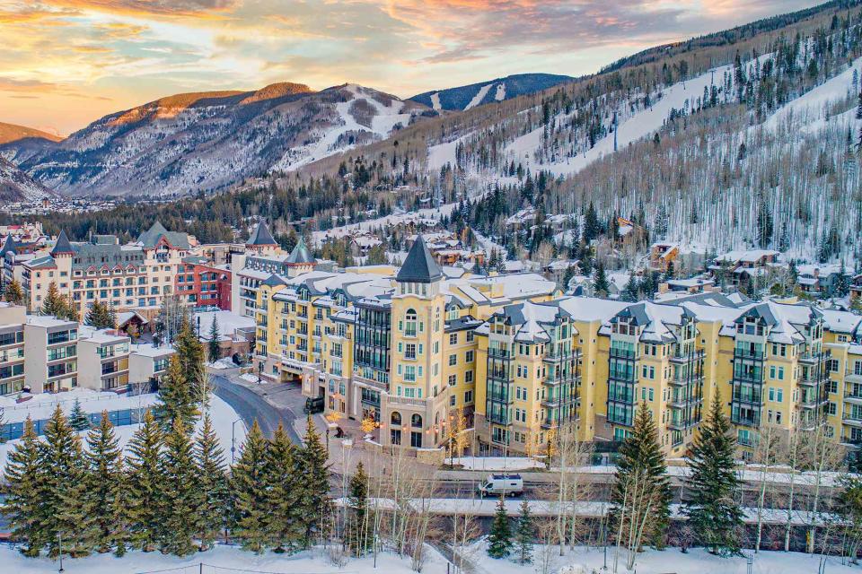 <p>Kruck20/Getty Images</p> View of snowy downtown Vail, Colorado during sunset 