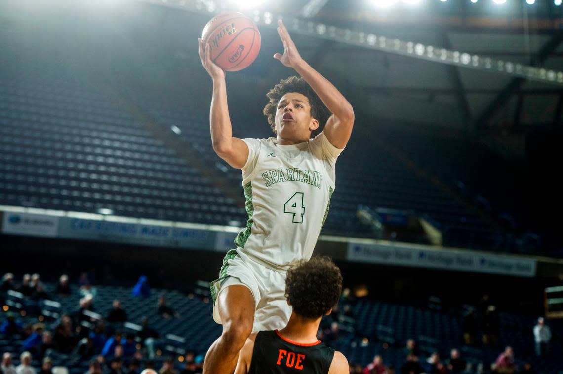 Skyline guard Trey Crandall (4) puts up a shot in the fourth quarter against Davis in the opening round of the Class 4A boys state basketball tournament on Wednesday, March 1, 2023 at the Tacoma Dome in Tacoma, Wash.
