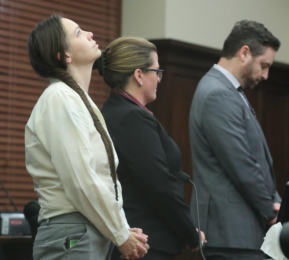 Erica Stefanko (left) reacts after hearing a jury had again found her guilty of aggravated murder and murder after her retrial in Summit County Common Pleas Court.