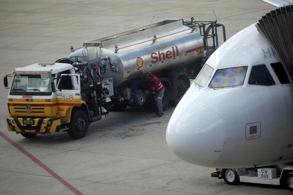 A man prepares to fuel an airplane at the Brasilia International airport, Brazil May 25, 2018. REUTERS/Ueslei Marcelino