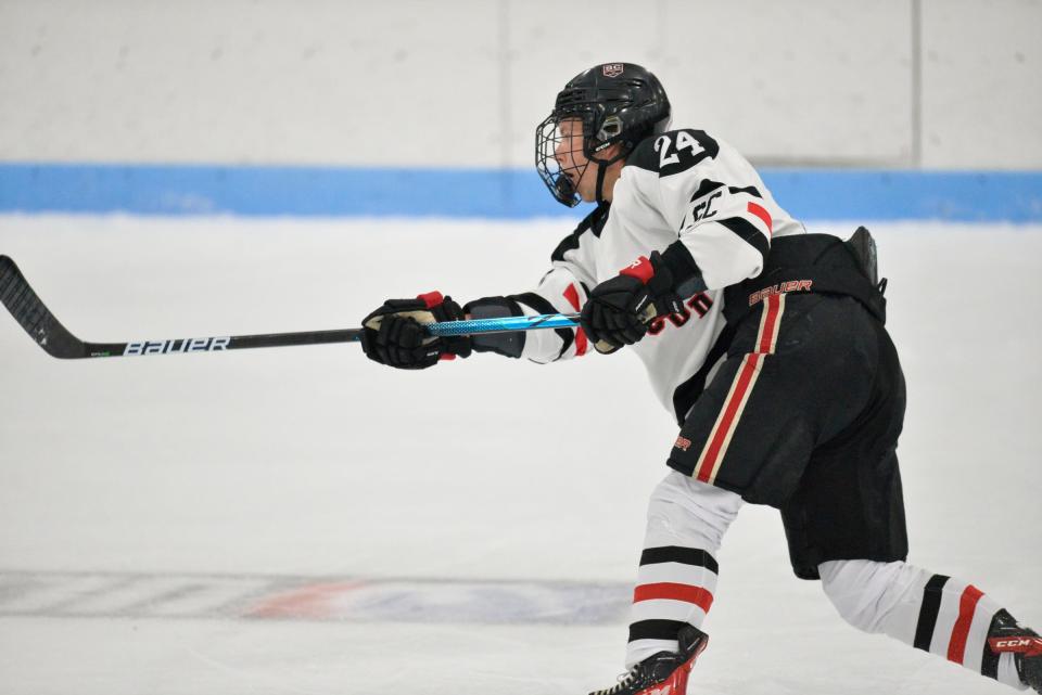 St. Cloud's Ripley Garden takes a slap shot at the blue line against Bemidji at the MAC on Saturday, Nov. 27, 2021. 