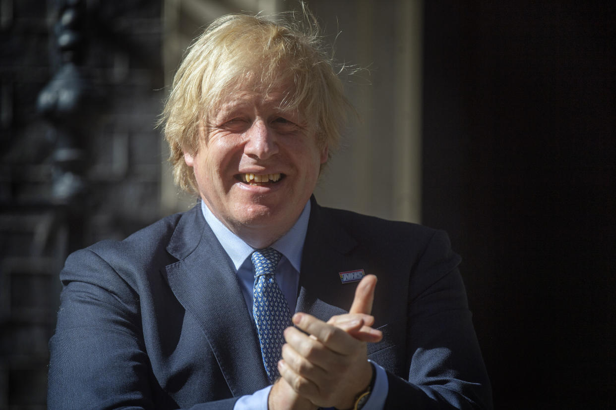 As part of the NHS birthday celebrations, Prime Minister Boris Johnson joins in the pause for applause to salute the NHS 72nd birthday outside 10 Downing Street, London.