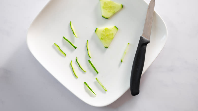 thin slices of cucumber on plate 