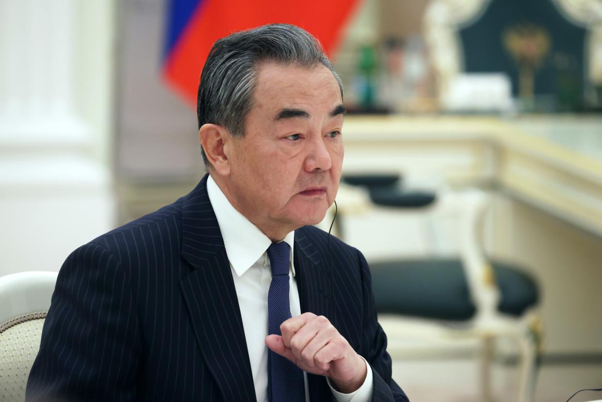 The Chinese Communist Party's foreign policy chief Wang Yi speaks to Russian President Vladimir Putin during their meeting at the Kremlin in Moscow, Russia, Wednesday, Feb. 22, 2023. (Anton Novoderezhkin, Sputnik, Kremlin Pool Photo via AP)