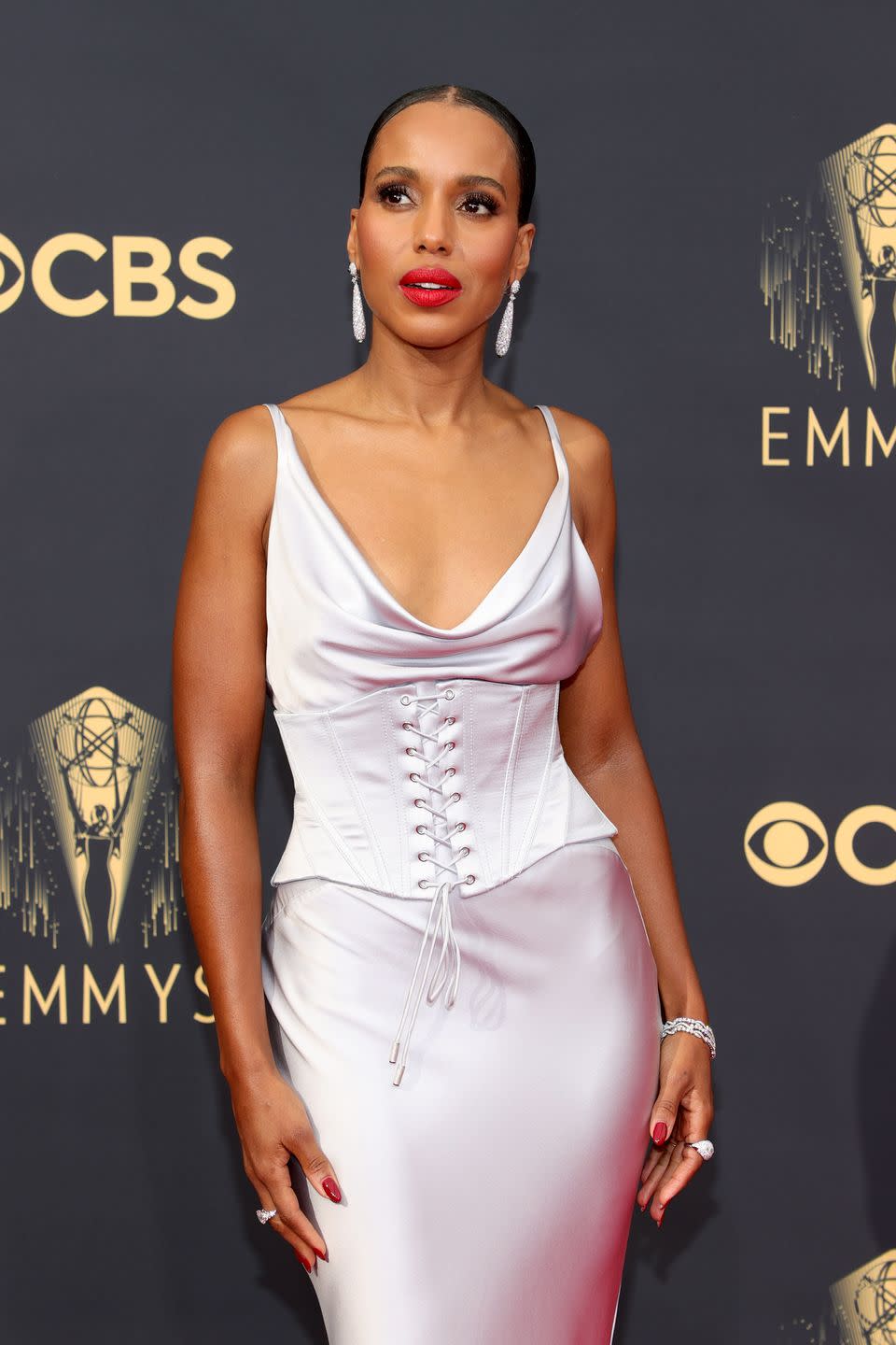 <p>Kerry Washington nailed standout minimalism, with a striking red lip, soft smoky eyes and a sleek, chic low plait. </p>