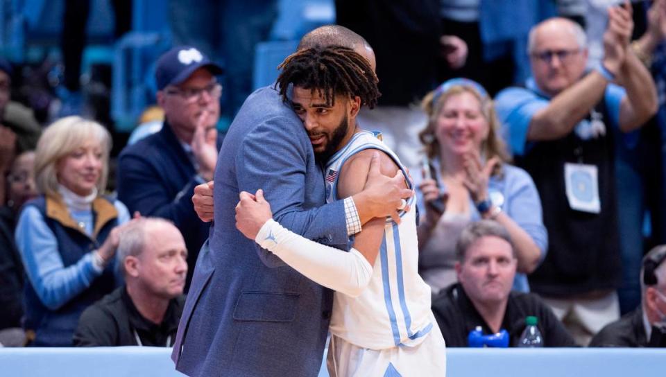 North Carolina coach Hubert Davis embraces R.J. Davis (4) as he comes out the game in the final minute of play after scoring a career high 36 points in the Tar Heels’ 85-64 victory over Wake Forest on Monday, January 22, 2024 at the Smith Center in Chapel Hill, N.C. Robert Willett/rwillett@newsobserver.com