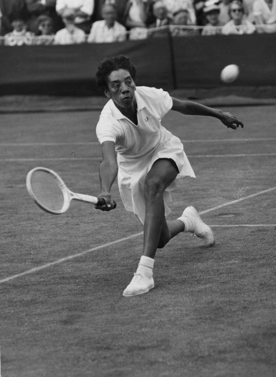 American tennis player Althea Gibson in action at the Wimbledon Lawn Tennis Championships.