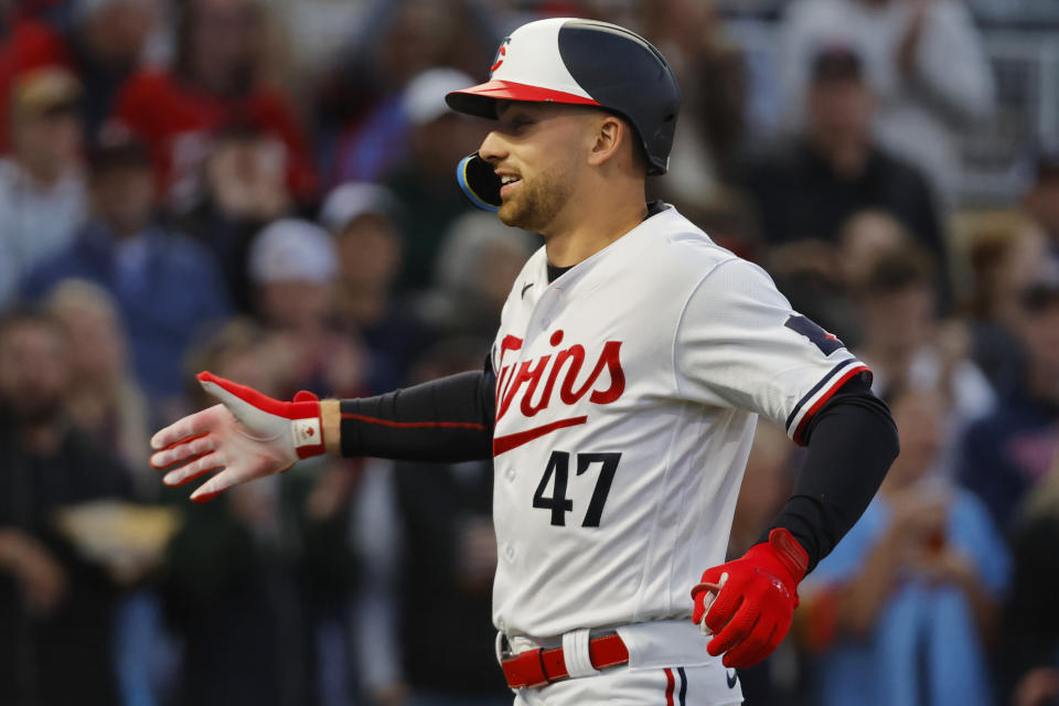 Minnesota Twins' Edouard Julien smiles after his solo home run against the Tampa Bay Rays during the third inning of a baseball game Tuesday, Sept. 12, 2023, in Minneapolis. (AP Photo/Bruce Kluckhohn)