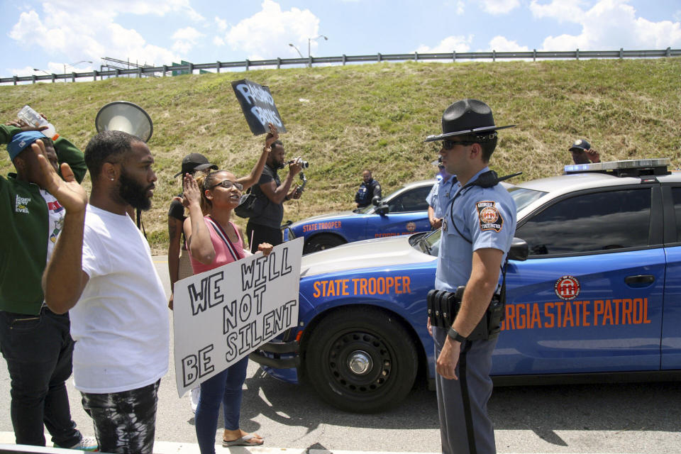 Protestors gather on University Ave near a Wendy's restaurant, Saturday, June 13, 2020 in Atlanta. Georgia authorities said Saturday a man was shot and killed in a late night struggle with Atlanta police outside a fast food restaurant after he failed a field sobriety test and resisted arrest. (Steve Schaefer/Atlanta Journal-Constitution via AP)
