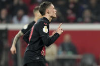 Leverkusen's Florian Wirtz celebrates after scoring his side's fourth goal from the penalty spot during the German soccer cup match between Bayer 04 Leverkusen and Fortuna Duesseldorf in Leverkusen, Germany, April 3, 2024. (AP Photo/Martin Meissner)