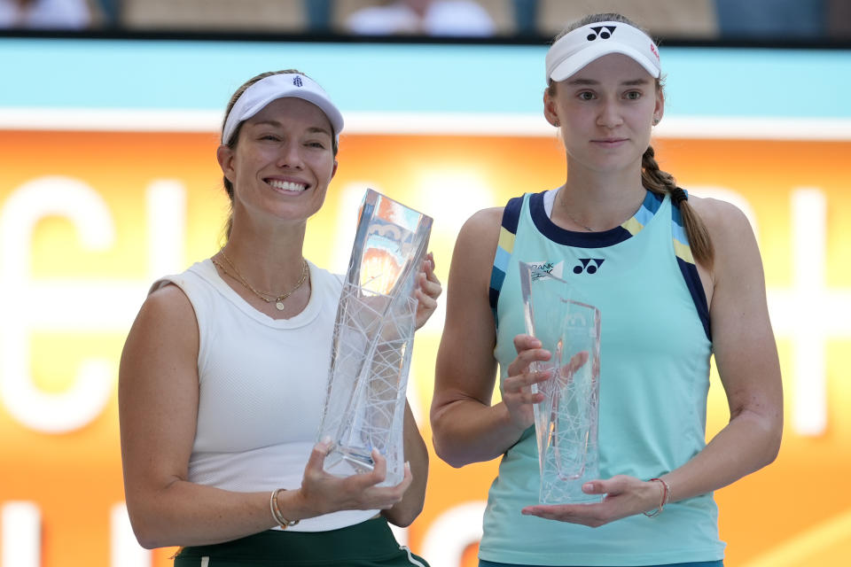 Danielle Collins, left, and Elena Rybakina, of Kazakhstan, right, pose with their trophies after Collins won the women's singles final of the Miami Open tennis tournament, Saturday, March 30, 2024, in Miami Gardens, Fla. (AP Photo/Lynne Sladky)