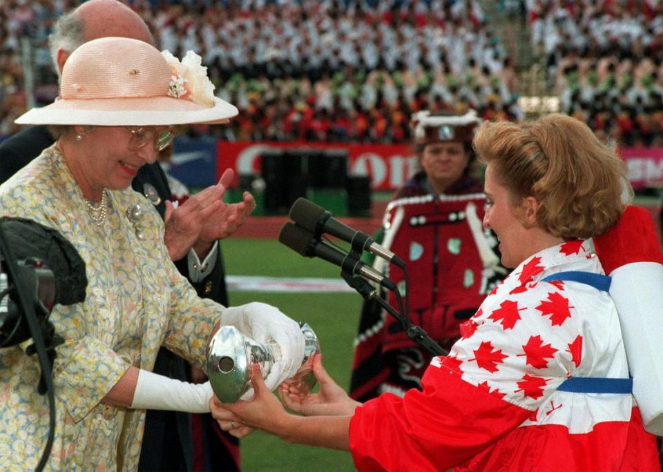 <span class="caption">Canadian Olympic Gold medallist Myriam Bedard hands the Queen’s Baton over to Queen Elizabeth during the Commonwealth Games opening ceremonies in Victoria, B.C., in 1994.</span> <span class="attribution"><span class="source">CANADIAN PRESS/Andrew Vaughan</span></span>