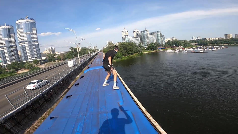 This heart-stopping footage shows a daredevil jumping from a speeding train into a river below. Yaro Panchenko, 18, is seen 'surfing' the subway car as it moves through his home town of Kiev in the Ukraine on August 1 this year. Not content with just surfing the train, Yaro then leaps from the carriage as it crosses a bridge into the water below. However, it didn't go entirely to plan as his Go Pro camera hit him in the face on impact and knocked out a tooth.