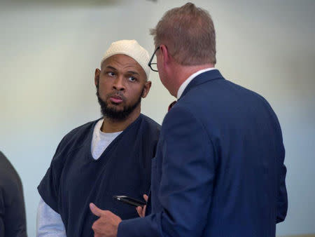 FILE PHOTO: Siraj Ibn Wahhaj (L) listens to his defense attorney Tom Clark during a hearing in Taos County District Court in Taos County, New Mexico, U.S., August 28,2018. Eddie Moore/Pool via REUTERS