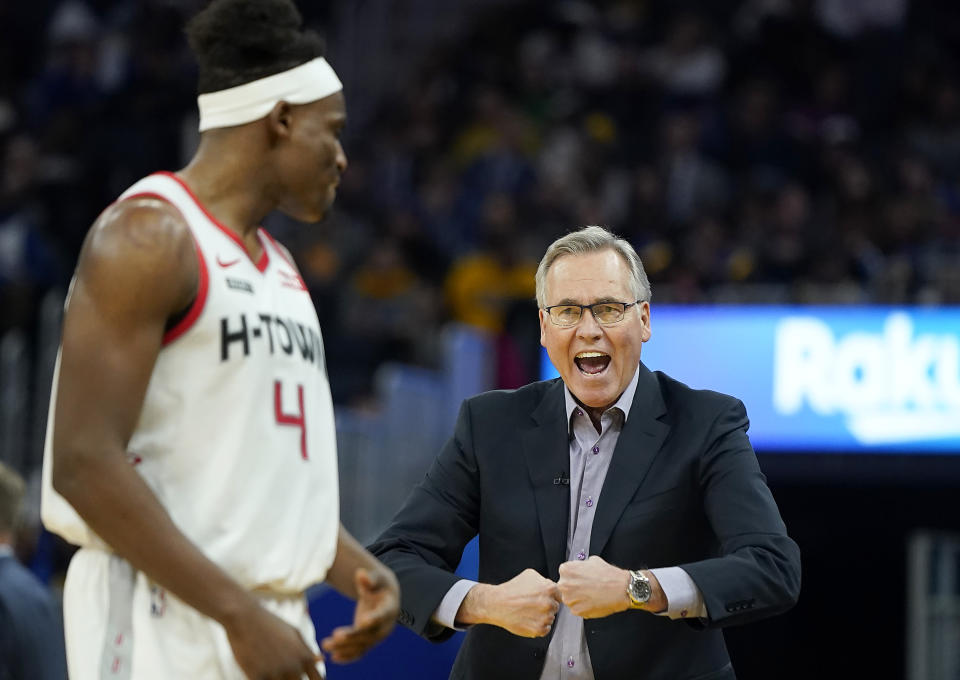 Houston Rockets coach Mike D'Antoni, right, talks with forward Danuel House Jr. during the first half of the team's NBA basketball game against the Golden State Warriors in San Francisco, Wednesday, Dec. 25, 2019. (AP Photo/Tony Avelar)